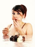 our tips to manage cravings could help this girl snacking on junk food