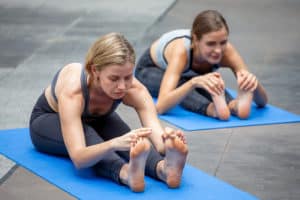 girls using manual isometric stretching