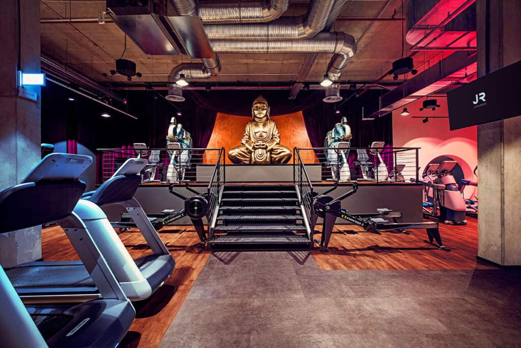 John Reed Fitness interior with Buddha statues