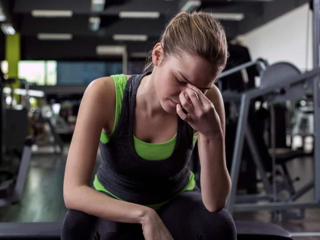Fitness girl needs a reliable way to cure headaches for her workouts. 