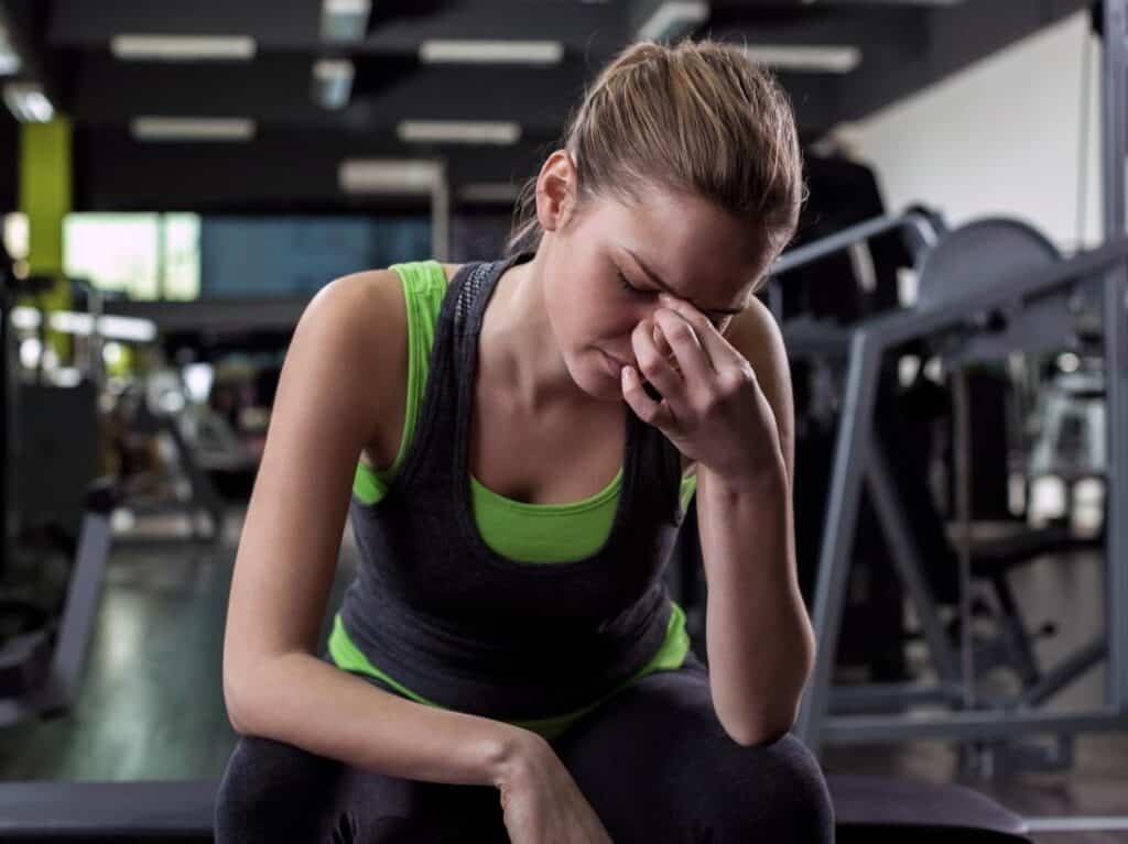 Fitness girl needs a reliable way to cure headaches for her workouts.
