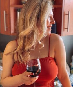 woman drinking wine at home