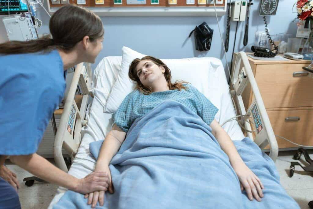 nurses providing emotional support to a patient